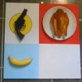 A gun, a fried chicken, a  banana and a white rectangle.